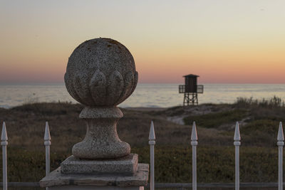 Scenic view of sea against clear sky during sunset