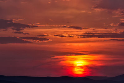 Scenic view of dramatic sky during sunset
