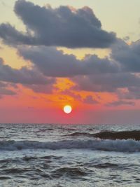 Scenic view of sea against romantic sky at sunset