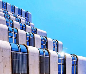 Low angle view of building against blue sky