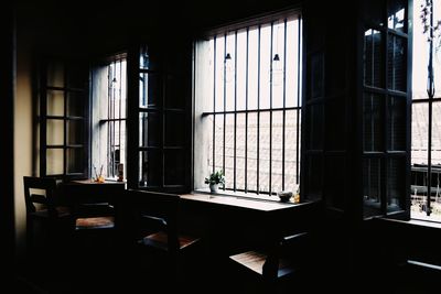 Empty chairs and table in building