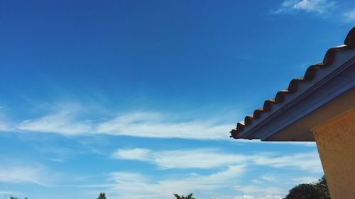 Low angle view of built structure against blue sky