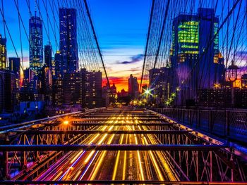 Illuminated bridge at night