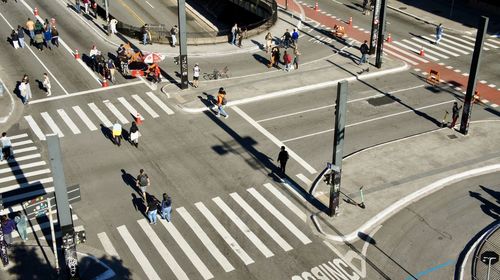 High angle view of people crossing road