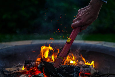 Close-up of bonfire on barbecue at night