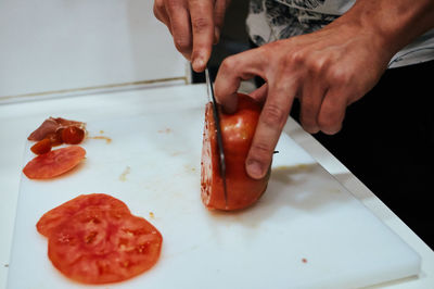 High angle view of person preparing food on table