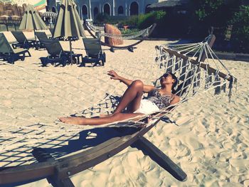 Woman relaxing on hammock