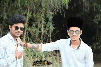 Portrait of young couple standing outdoors