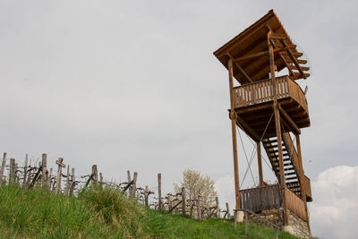 Low angle view of traditional windmill against sky
