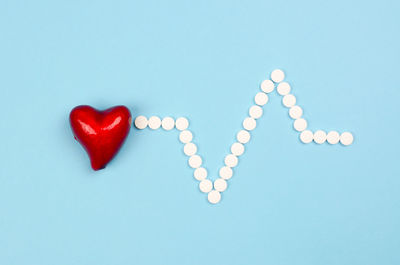 Close-up of heart shape against blue background