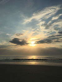 Scenic view of beach against sky during sunset