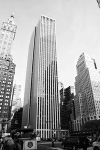 Low angle view of buildings in city against sky