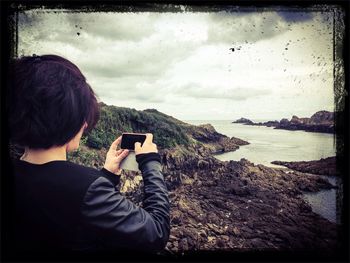 Rear view of woman looking at sea