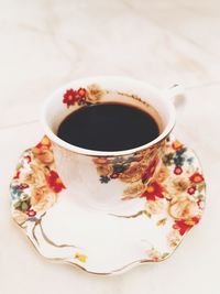 High angle view of coffee cup on table