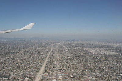 Aerial view of cityscape against sky