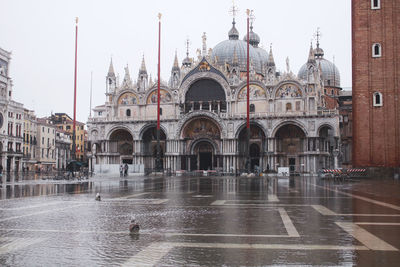 View of buildings in city during rainy season