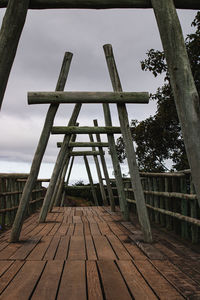 Low angle view of metallic structure against sky