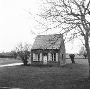 House on field against sky