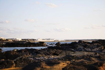 Bridge over sea against sky