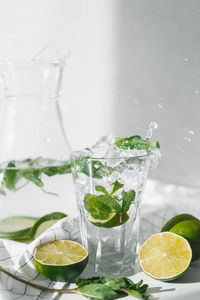 Glass of fruits on table