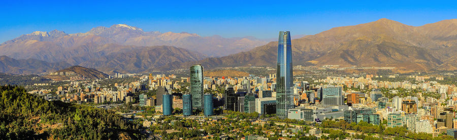 View of cityscape against mountain range