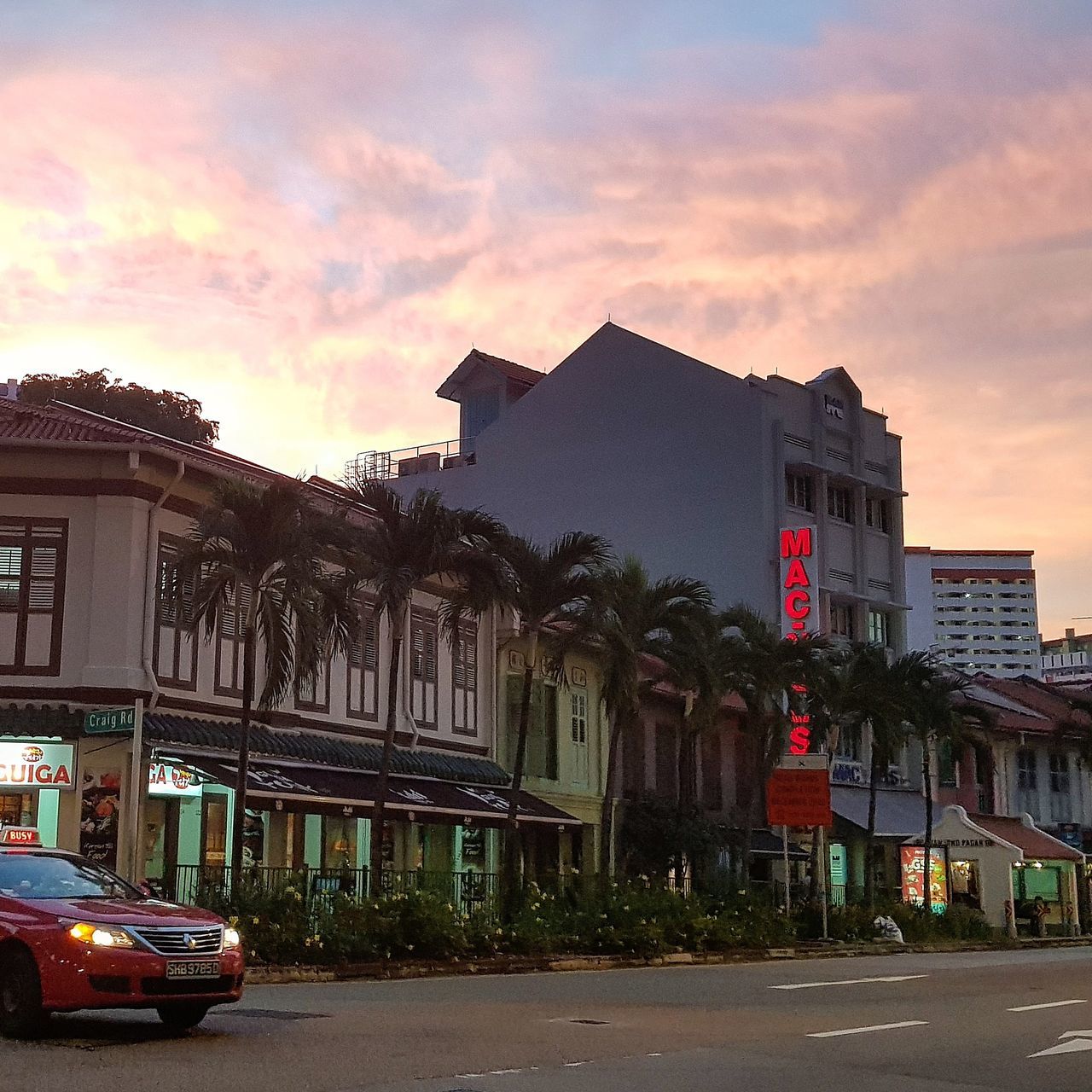 architecture, building exterior, built structure, car, land vehicle, street, transportation, sky, outdoors, city, road, no people, day