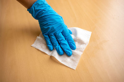 High angle view of woman working on blue table