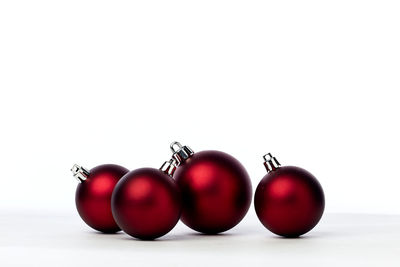 Close-up of tomatoes against white background
