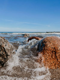 Scenic view of sea against clear blue sky