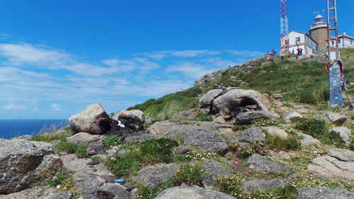 Scenic view of rock formations against blue sky