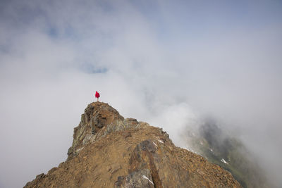 High angle view of man standing on cheam peak against cloudy sky