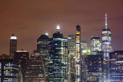 Illuminated buildings in city at night