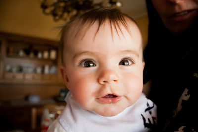 Close-up portrait of cute baby girl at home