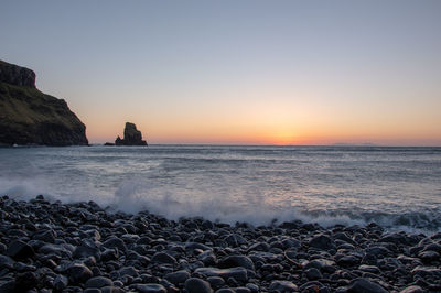 Scenic view of sea against clear sky during sunset