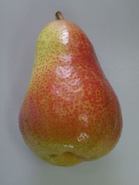 Close-up of red fruit over white background