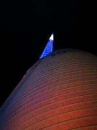 Low angle view of illuminated building at night