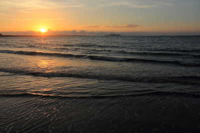 Scenic view of sea against sky during sunset