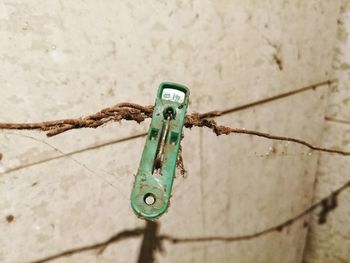 High angle view of old rusty metal on wall