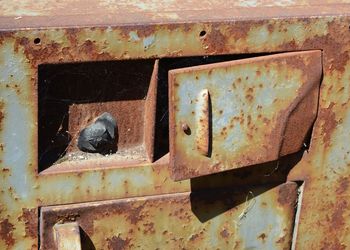 Close-up of abandoned rusty locker