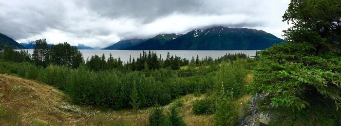 Scenic view of mountains against cloudy sky