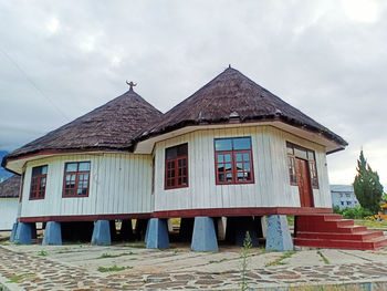 Facade of old building against sky