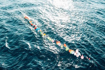 High angle view of balloons in sea