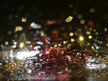 Defocused image of illuminated city at night