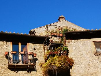 Low angle view of traditional building against blue sky