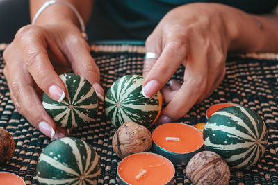 Midsection of woman holding christmas decorations