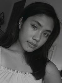 Portrait of smiling woman at home