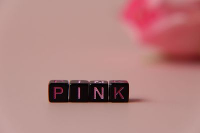 Close-up of information sign on table