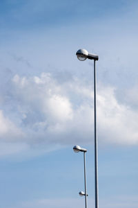 Low angle view of street light against sky