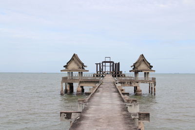 View of pier on sea against sky