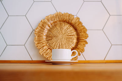 Close-up of coffee cup on table